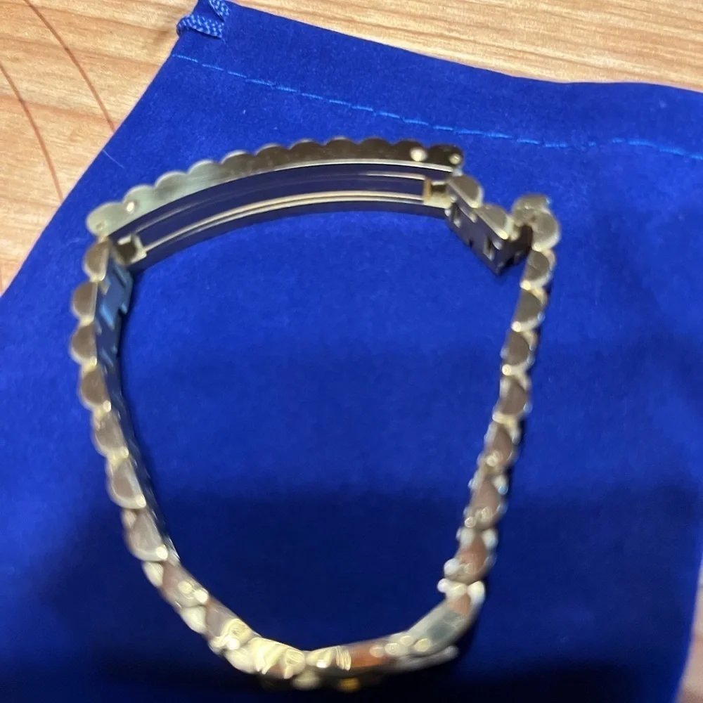 gold bracelet within crown on it. It is NOT a …. But your friends won’t know